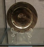 A tarnished silver dish given by Prime Minister Margaret Thatcher.